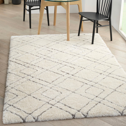 Tapis Nourison luxueux à poils longs et ultra moelleux, motif géométrique abstrait